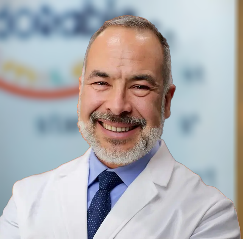 Dr. Peter J Theodorou orthodontist in Corinth TX smiling in dental office