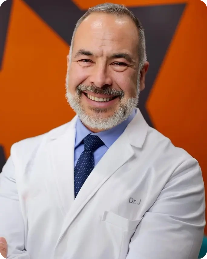 Dr. Peter J Theodorou orthodontist in Corinth TX smiling in dental office